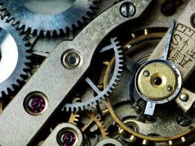 close up of gears in antique watch